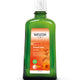 Weleda Arnica Muscle Soak bottle on a white background