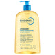A 1 litre bottle of Bioderma Atoderm Soothing Lip-Replenishing Cleansing Oil, featuring a translucent yellow liquid and a blue pump dispenser, on a white background.