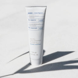 KORRES Greek Yoghurt Foaming Cream Cleanser with Pre + Probiotics stood up right on a white background