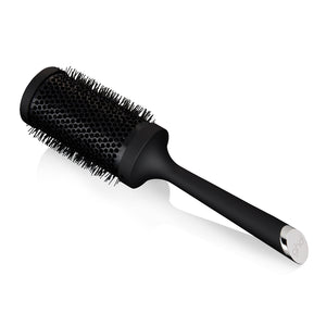 Black round hairbrush on a white background