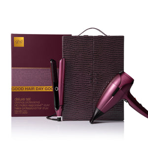 Purple hair dryer and styling tool with branded packaging on a white background