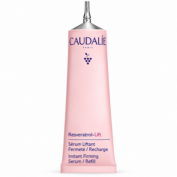 A pink squeeze tube of Caudalie Paris Resveratrol-Lift Serum Refill, featuring a silver metal applicator tip, on a clean white background.