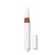 Concealer pen with brown applicator and white casing on a white background