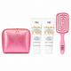 A FUL brand hair care set on a white background, featuring a metallic pink zippered pouch, a tube of shampoo, a tube of conditioner, and a pink hairbrush with rhinestones.
