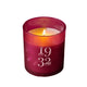 Pink candle in a glass holder with '1932 Gatineau' text on a pink background