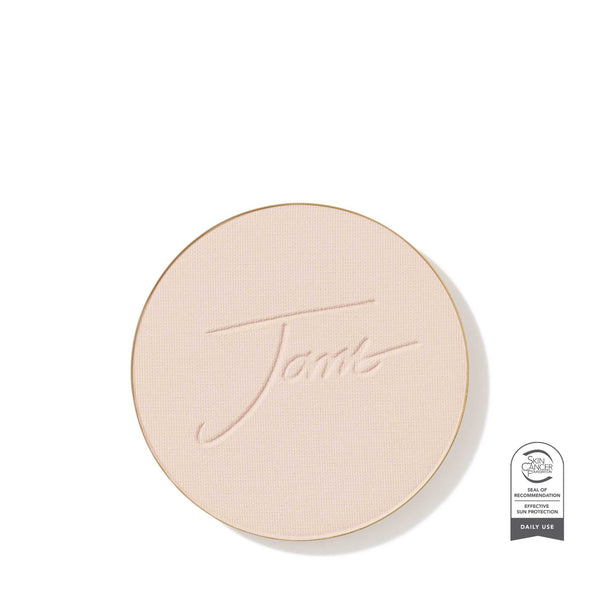 Round beige compact with 'Tarte' branding on a white background