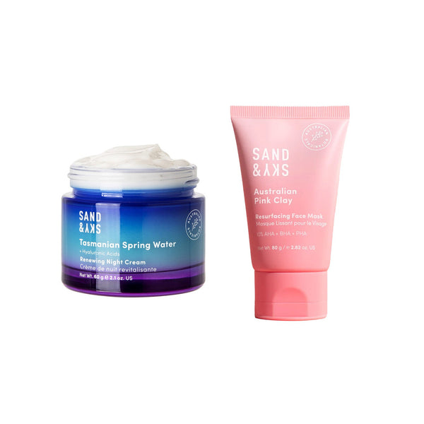 A skincare set featuring a blue and purple gradient jar of Sand & Xks Tasmanian Spring Water Reviving Night Cream with white cream visible at the top, and a pink squeeze tube of Sand & Xks Australian Pink Clay Revolving Face Mask, on a plain white background.