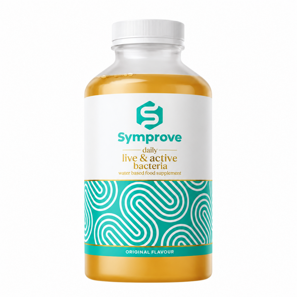 A bottle of Symprove daily live & active bacteria water based food supplement, featuring a white cap, clear bottle showing golden-yellow liquid, and a white label with teal and gold text and pattern.