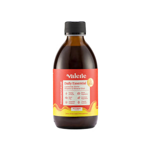 Bottle of Valerie Daily Essential on a light beige background