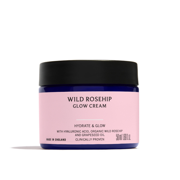 Pink jar of Wild Rosehip Glow Cream with black lid on a white background