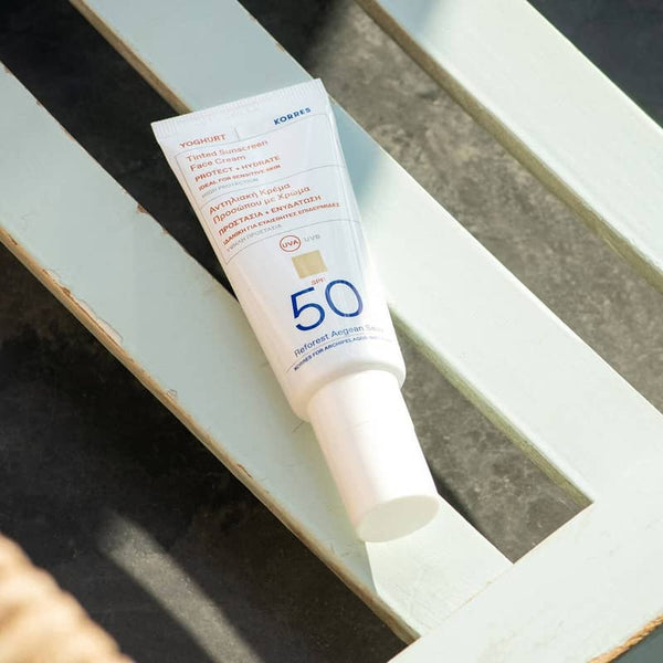 KORRES Yoghurt Face Sunscreen SPF50 on a light green bench