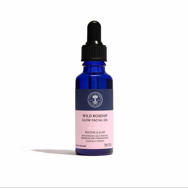 Blue bottle of Wild Rosehip Glow Facial Oil with a dropper on a white background