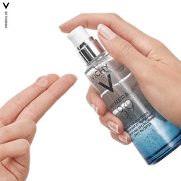 Vichy Minéral 89 Hyaluronic Acid Hydrating Serum - Hypoallergenic, For All Skin Types being applied to fingers