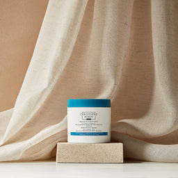 Christophe Robin Purifying Mask in front of a beige curtain 