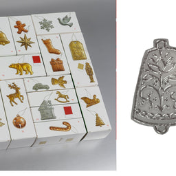 A set of white Christmas advent-style gift boxes with assorted metallic ornament illustrations on the front, shown beside a close-up of a silver ornament piece with an embossed tree design.