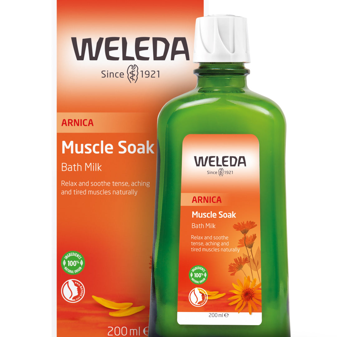 Weleda Arnica Muscle Soak Bath Milk packaging and bottle on a white background
