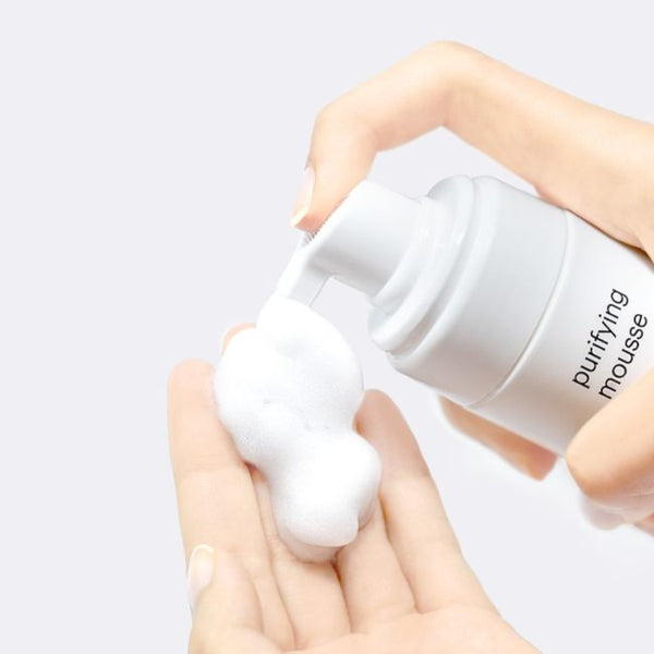 mesoestetic Purifying Mousse being poured out onto a hand