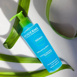 Bioderma Sébium Purifying Foaming Gel Oily to Blemish-Prone Skin bottle on top of three leaves 