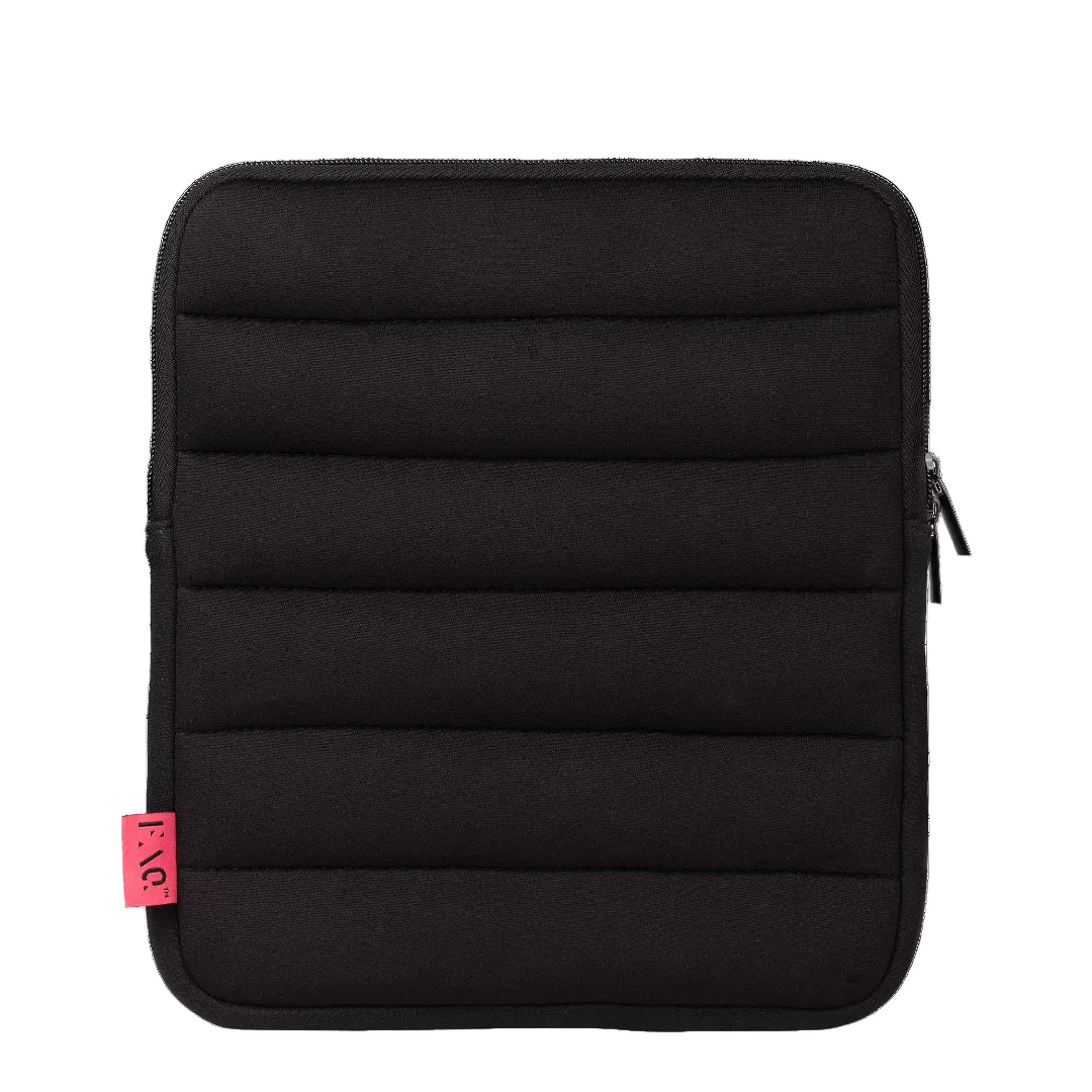 A black padded neoprene sleeve with horizontal quilting, a zippered closure, and a small pink tag on the lower left, shown against a plain white background.