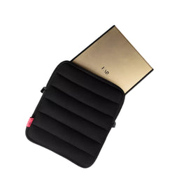 A black padded tablet sleeve with a gold interior lining, shown partially open on a clean white background.
