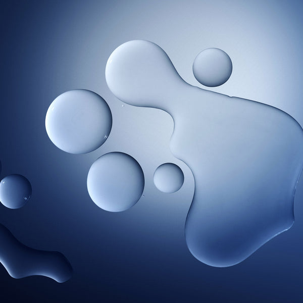 Abstract blue liquid droplets and translucent blobs on a dark blue gradient background.