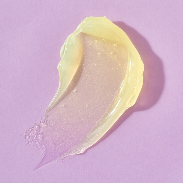 Yellow cream smear on a pink background