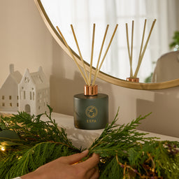 ESPA Winter Spice Reed Diffuser in front of a mirror