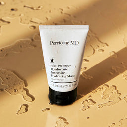 Perricone MD Hyaluronic Intensive Hydrating Mask tube stood upright in a puddle of water