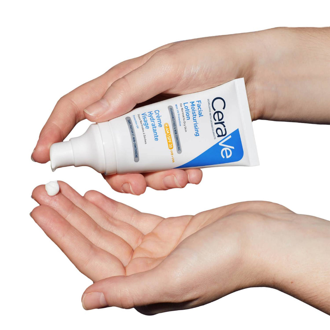 Model applying CeraVe Facial Moisturising Lotion SPF 30 to their hands