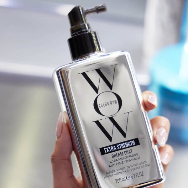 Model holding Color Wow Dream Coat Extra Strength