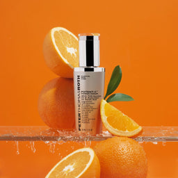 Peter Thomas Roth Potent-C Power Serum bottle surrounded by oranges