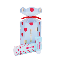 Nursem gift set featuring a light blue polka dot box with a red ribbon, a matching wrapped item, and a small light blue tube with red and white text, all on a light gray background.
