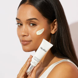 a model with the serum on her face