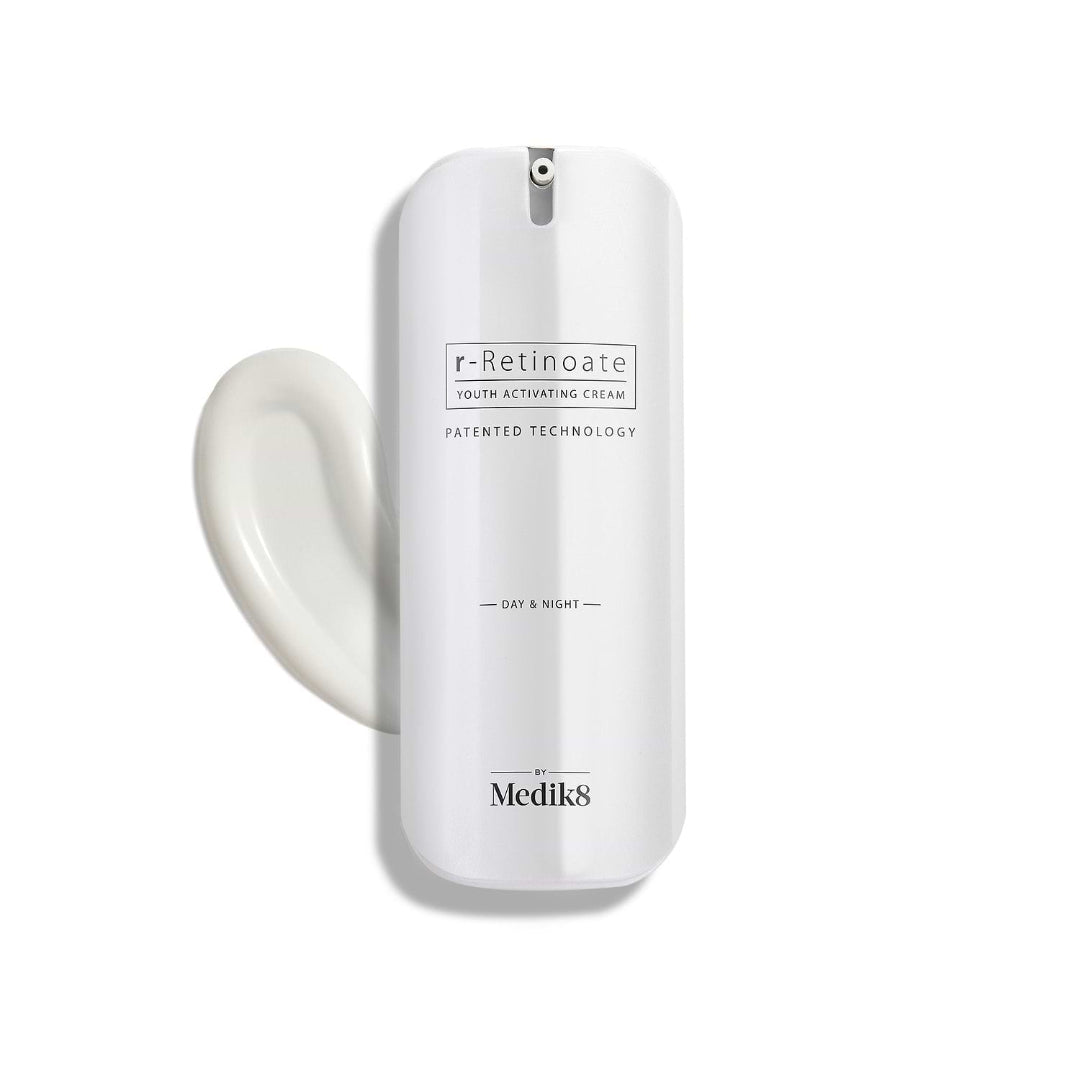 Medik8 Retinol cream bottle with a swatch of cream on a white background
