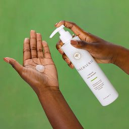 a person applying the lotion to their hand