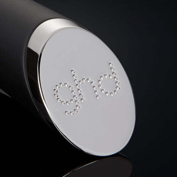Close-up of a black and silver cylindrical object with 'GIVI' branding on a black background