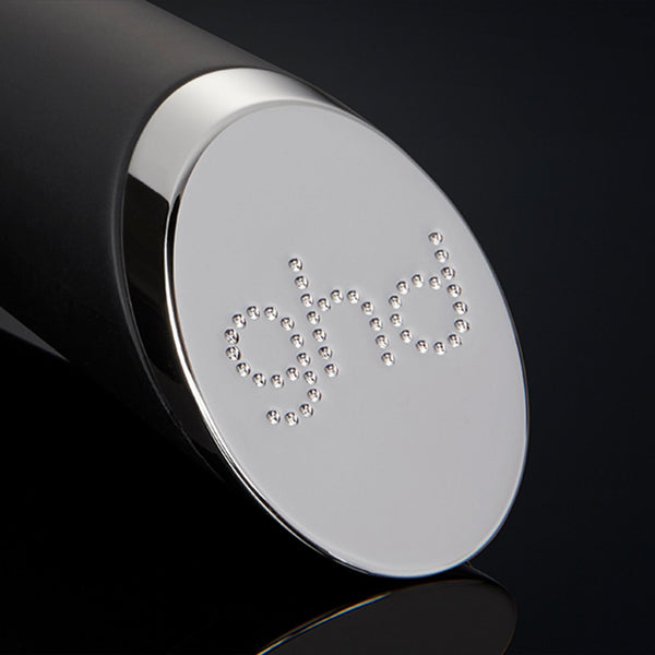 Close-up of a black and silver cylindrical object with 'GIVI' branding on a black background