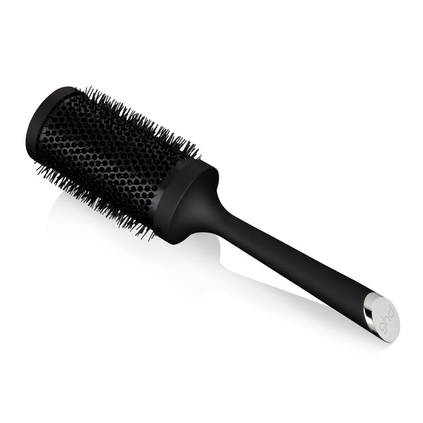 Black round hairbrush on a white background