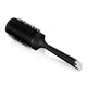Black round hairbrush on a white background
