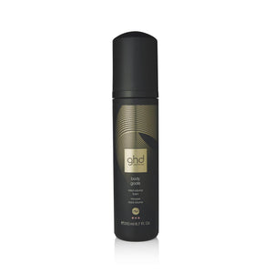 Black spray bottle with gold label on a white background