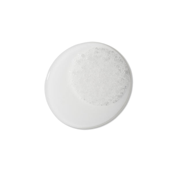 Round marble coaster with gray veining on a white background