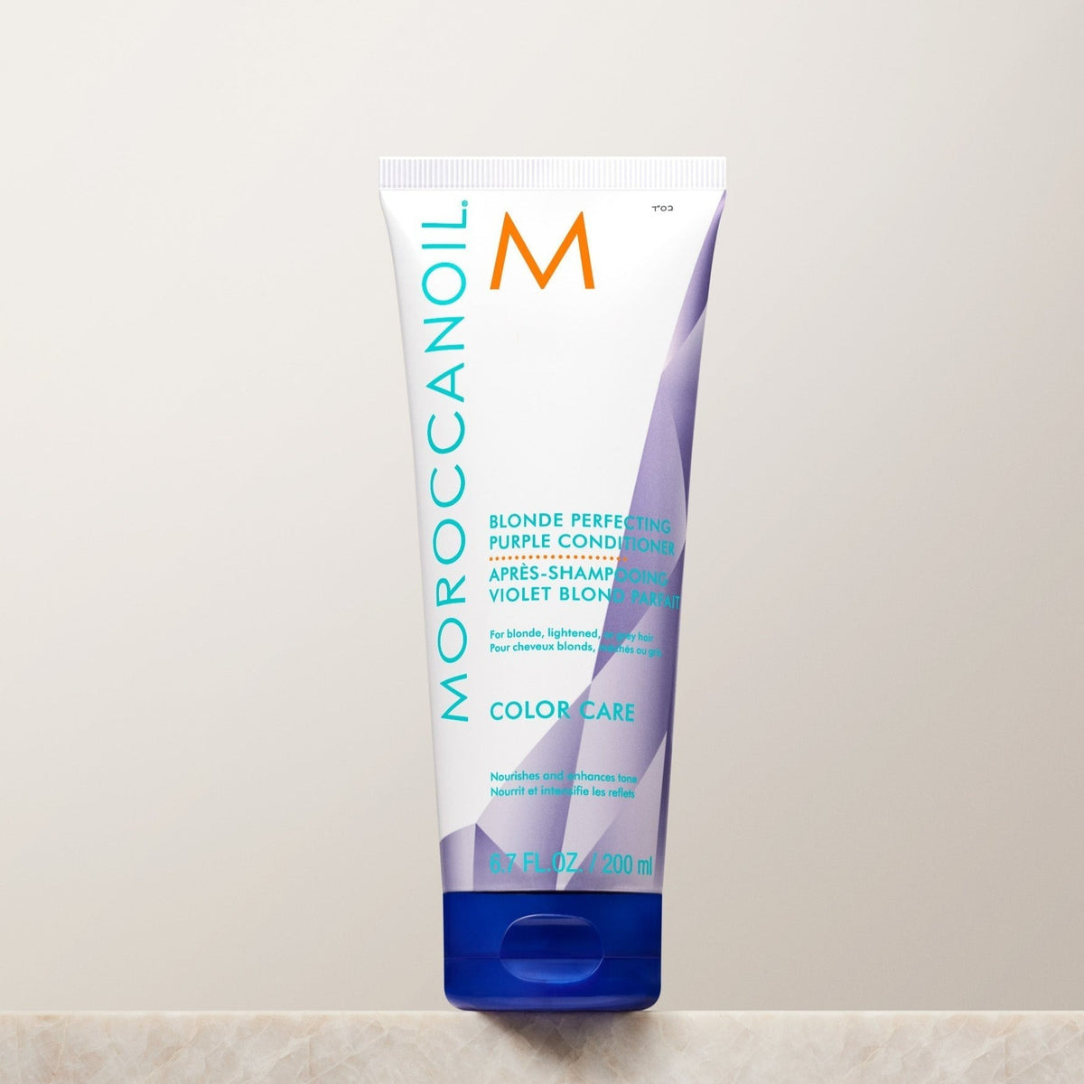 Moroccanoil Blonde Perfecting Purple Conditioner on a perch