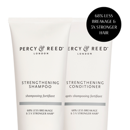 Two white tubes of Percy & Reed London haircare products, labeled Strengthening Shampoo and Strengthening Conditioner, with a black circular callout in the top right stating '68% Less Breakage & 3x Stronger Hair'.