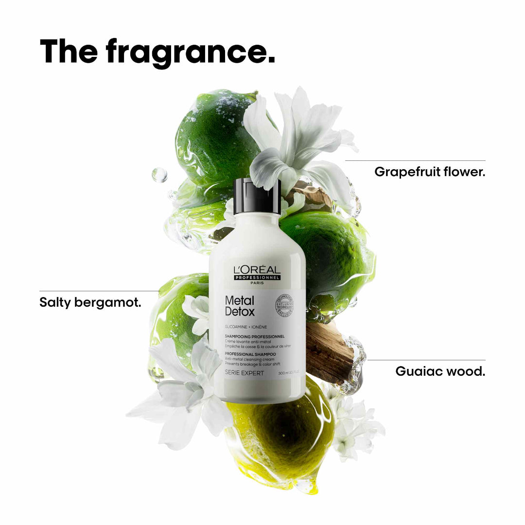L'Oreal Metal Detox shampoo bottle with green leaves and flowers on a white background