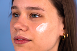a closeup of Proto-col Collagen Cleansing Milk applied to a womens face