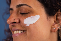 a woman with Proto-col Microdermabrasion applied to her face