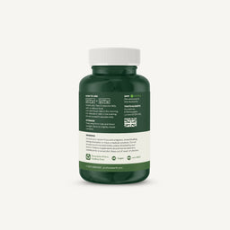 A dark green supplement bottle with a white cap, showing the back label with text, icons, and a small Union Jack, on a light gray background.