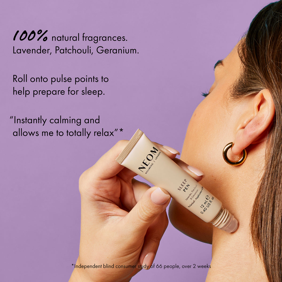 Person applying NEOM sleep balm to their neck with a purple background