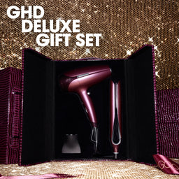 GH Deluxe gift set with hair dryer and styling tool on a glittery background