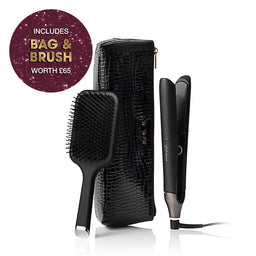 Hair straightener and brush set with a black textured case on a white background